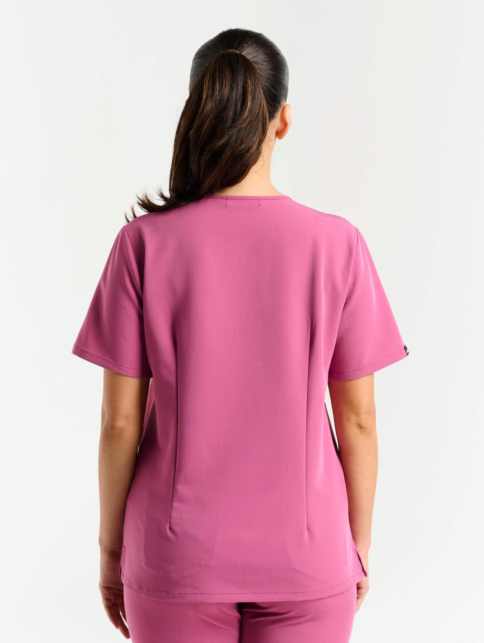 full body view of red violet one pocket v neck scrub top